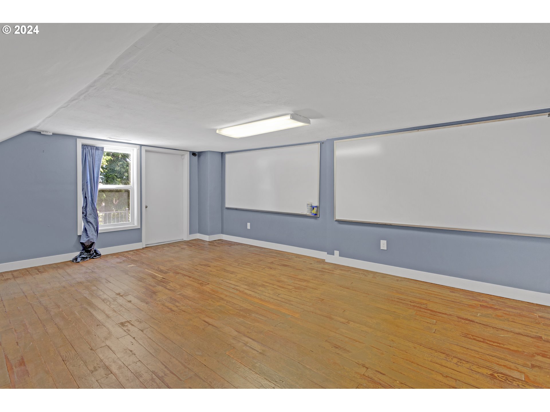 15525 Northeast Caples Road Brush Prairie, WA 98606 - Photo 26 of 40 a view of an empty room with wooden floor