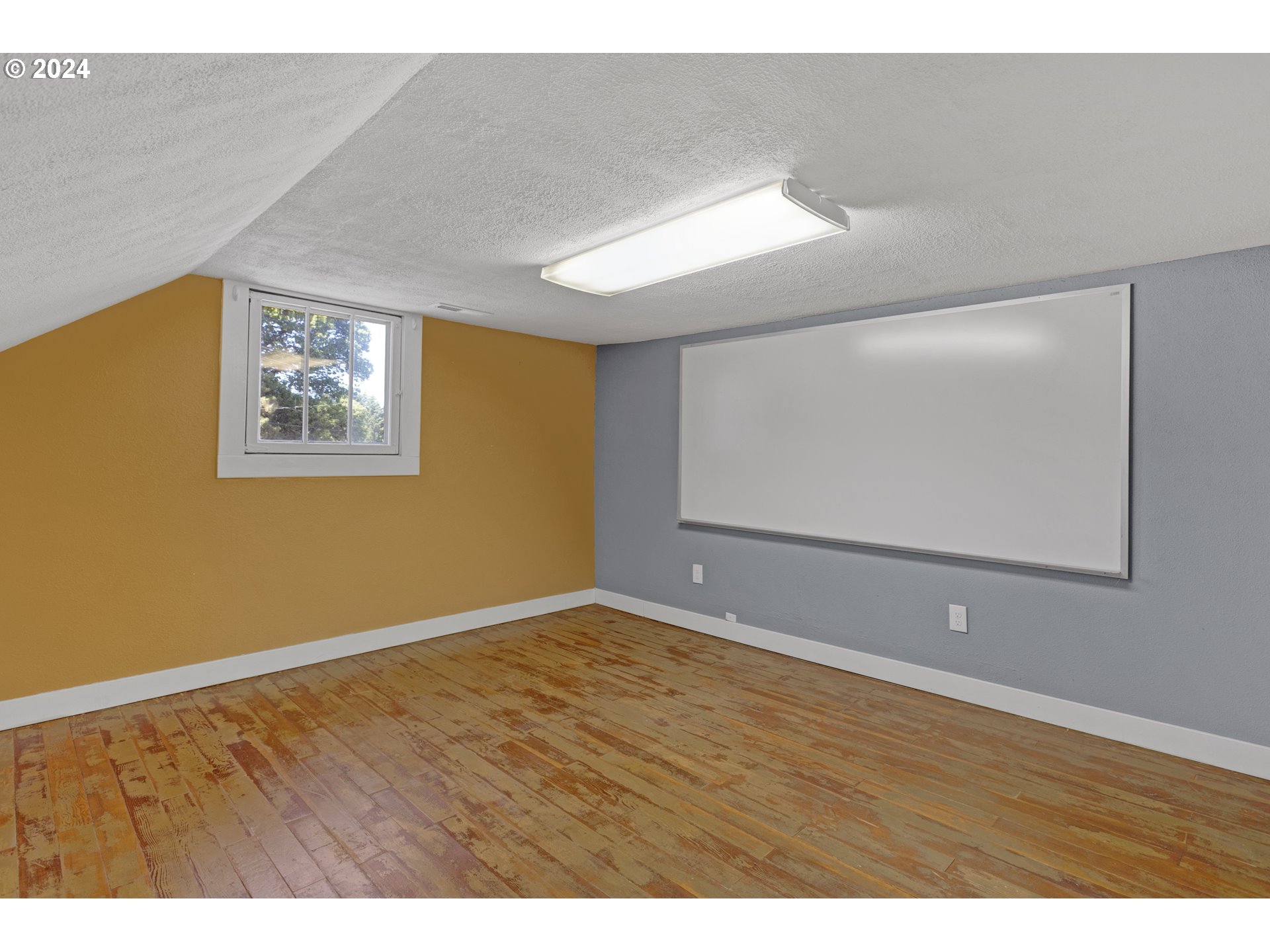15525 Northeast Caples Road Brush Prairie, WA 98606 - Photo 29 of 40 a view of an empty room with wooden floor