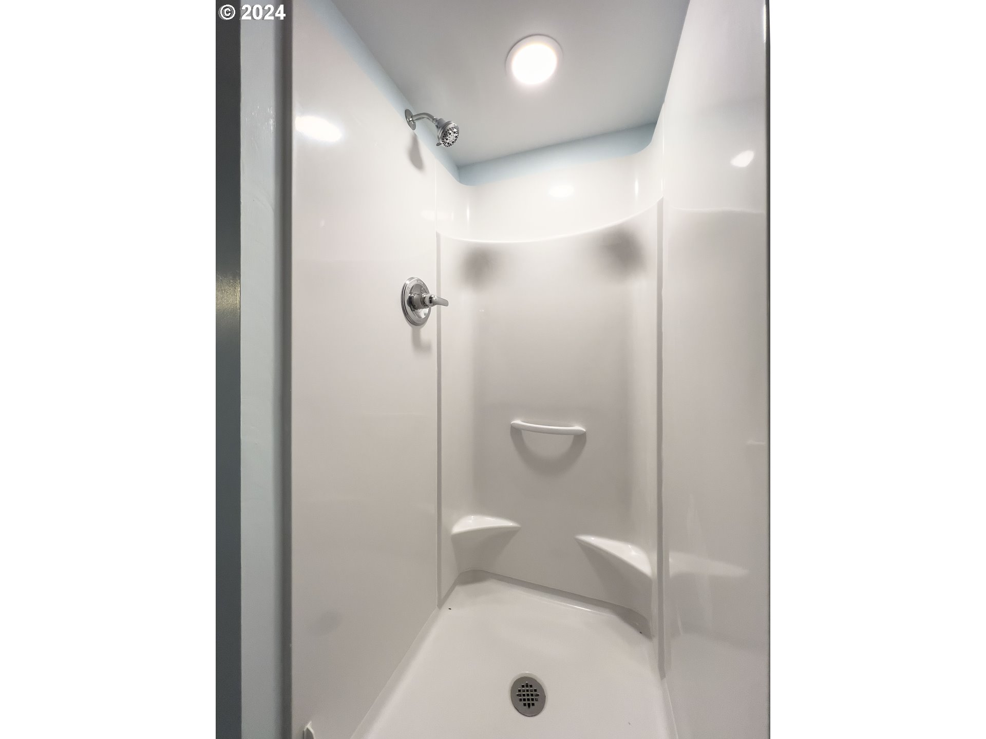 15525 Northeast Caples Road Brush Prairie, WA 98606 - Photo 33 of 40 a bathroom with a shower and toilet