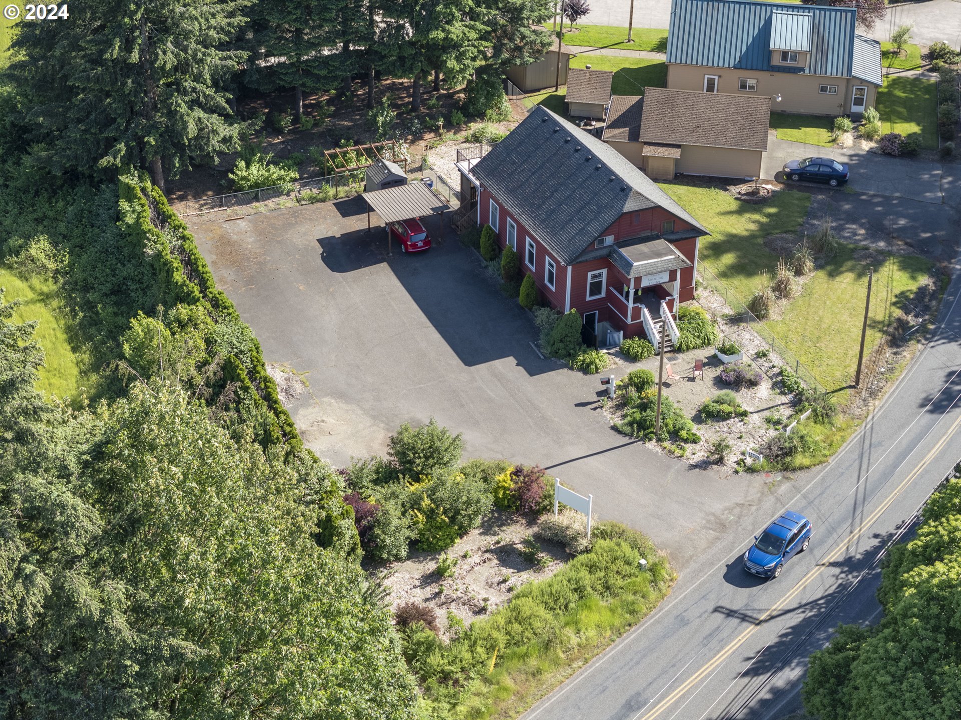 15525 Northeast Caples Road Brush Prairie, WA 98606 - Photo 34 of 40 an aerial view of a house with a yard and garden