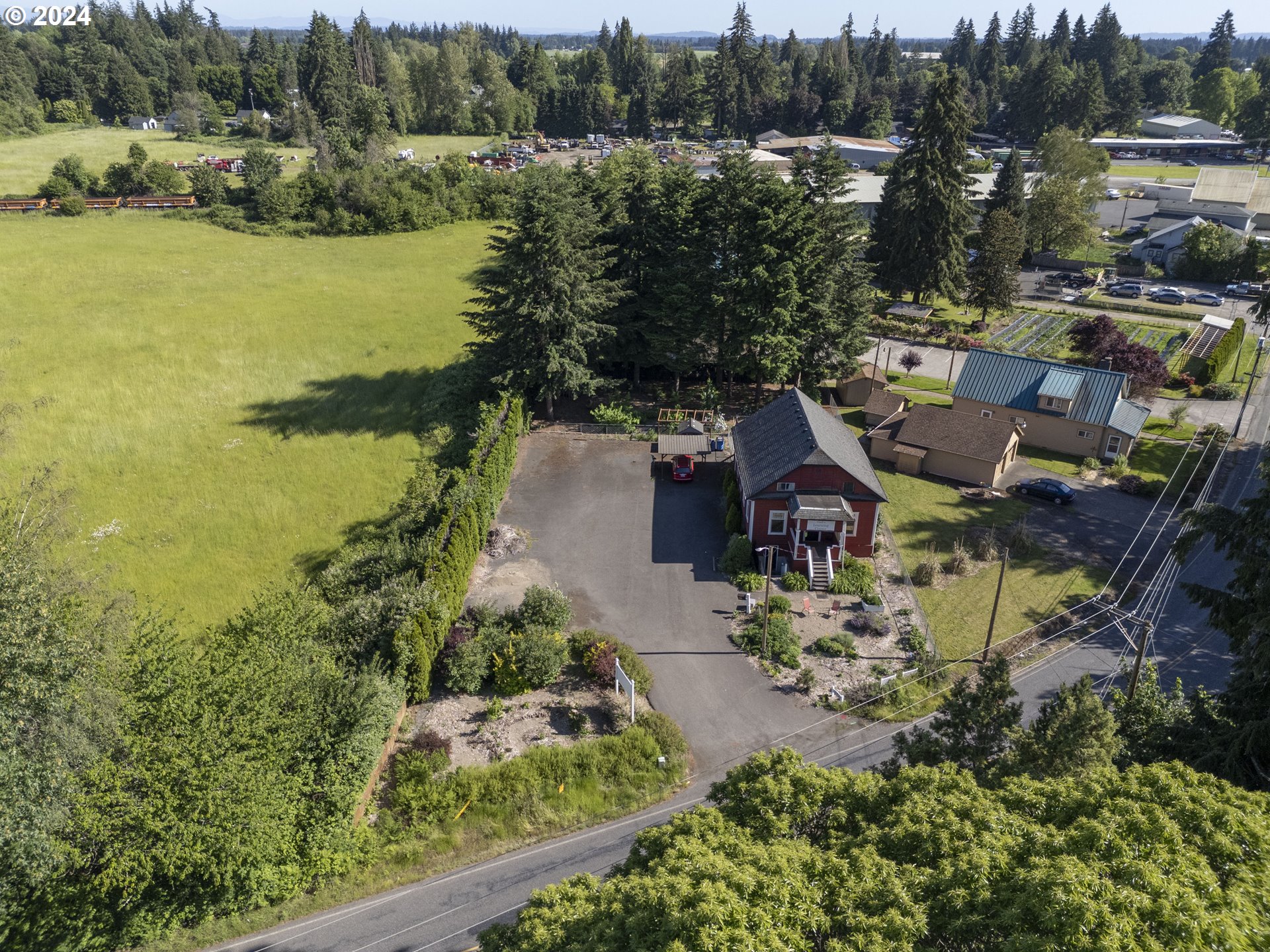 15525 Northeast Caples Road Brush Prairie, WA 98606 - Photo 40 of 40 an aerial view of residential houses with outdoor space and lake view