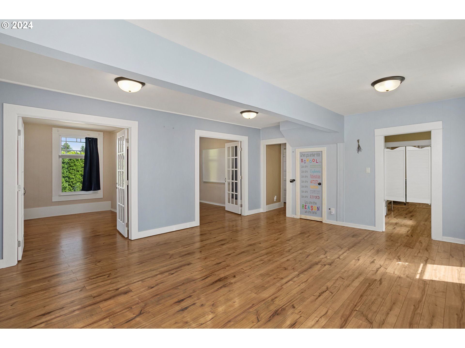 15525 Northeast Caples Road Brush Prairie, WA 98606 - Photo 8 of 40 a view of an empty room with wooden floor and window