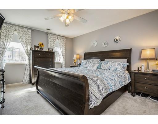 95 Haggerty Road Charlton, MA 01507 - Photo 18 of 30 a bedroom with a bed and a chandelier