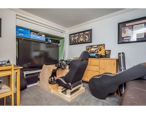 95 Haggerty Road Charlton, MA 01507 - Photo 23 of 30 a living room with furniture and a flat screen tv