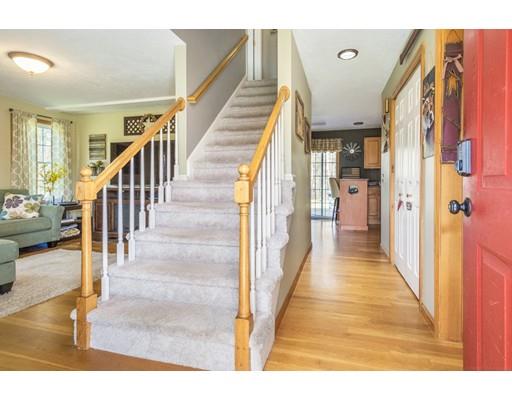 95 Haggerty Road Charlton, MA 01507 - Photo 4 of 30 a view of a hallway with wooden floor and staircase