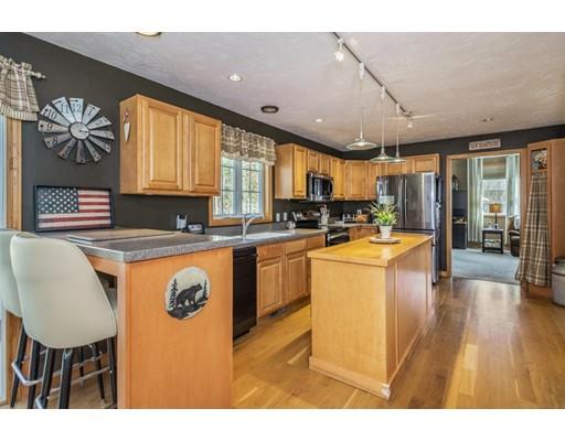 95 Haggerty Road Charlton, MA 01507 - Photo 9 of 30 a kitchen with stainless steel appliances granite countertop a sink a stove and a refrigerator