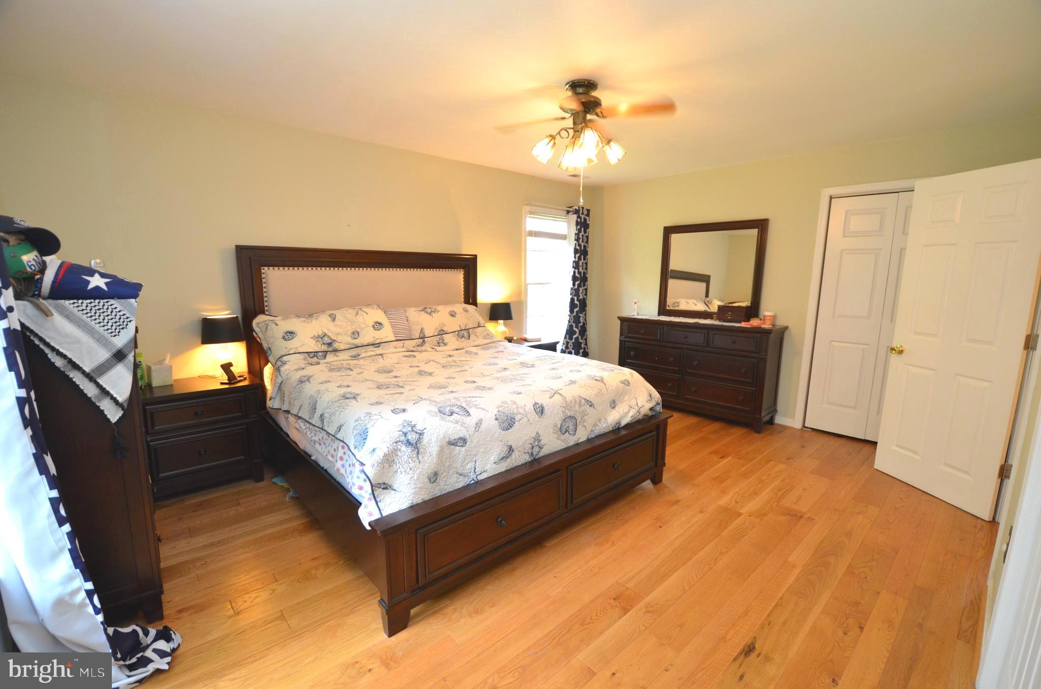 1527 Snug Harbor Road Shady Side, MD 20764 - Photo 15 of 39 Owners bedroom with hardwood floors