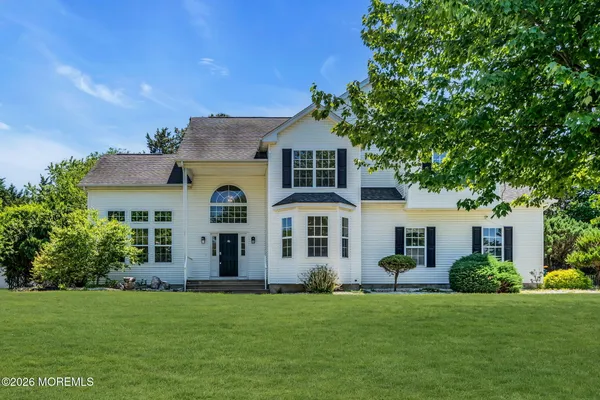 front view of a house with a garden