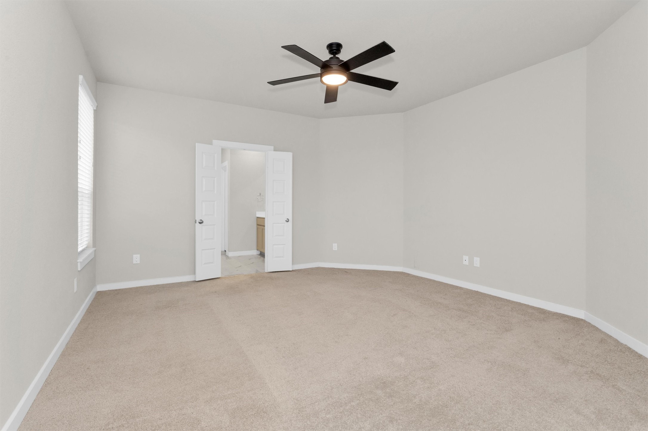2210 Reed Cave Ln Spring Spring, TX 77386 - Photo 23 of 39 Primary bedroom, with double doors into the primary bathroom.