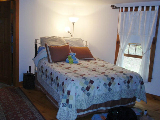 5 Smith Road Sandisfield, MA 01255 - Photo 15 of 38 a bedroom with a bed and wooden floor