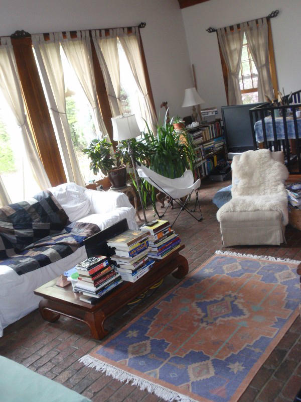 5 Smith Road Sandisfield, MA 01255 - Photo 5 of 38 a living room with furniture and a chandelier