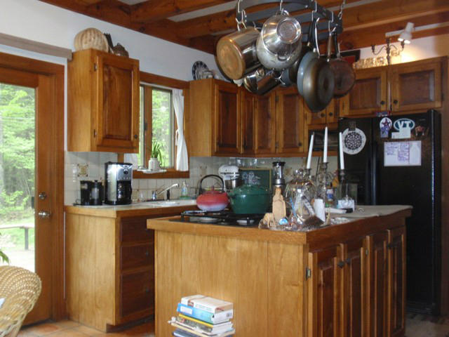 5 Smith Road Sandisfield, MA 01255 - Photo 10 of 38 a kitchen with a refrigerator a stove top oven a sink and a window