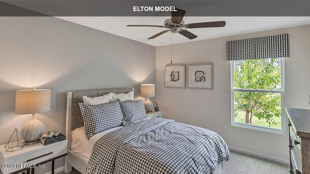 65 Zancara Street St. Augustine, FL 32084 - Photo 11 of 45 a bedroom with a bed and a window