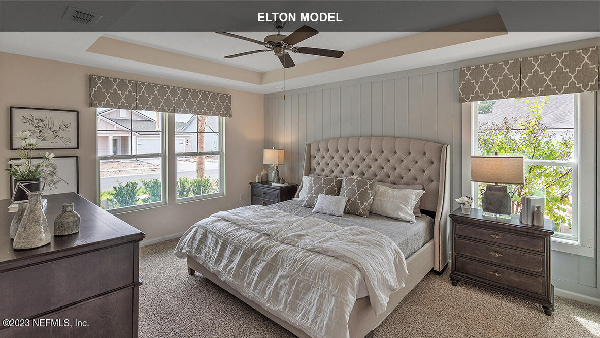 65 Zancara Street St. Augustine, FL 32084 - Photo 12 of 45 a bedroom with a bed a couch and a window