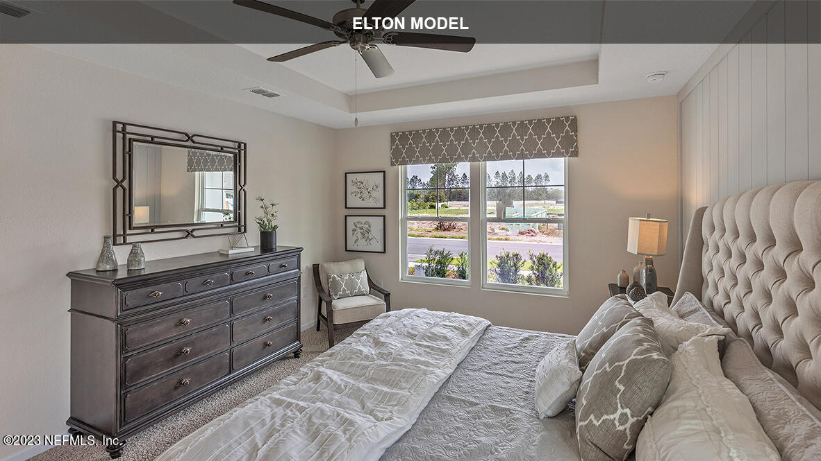 65 Zancara Street St. Augustine, FL 32084 - Photo 13 of 45 a bedroom with a bed and a dresser