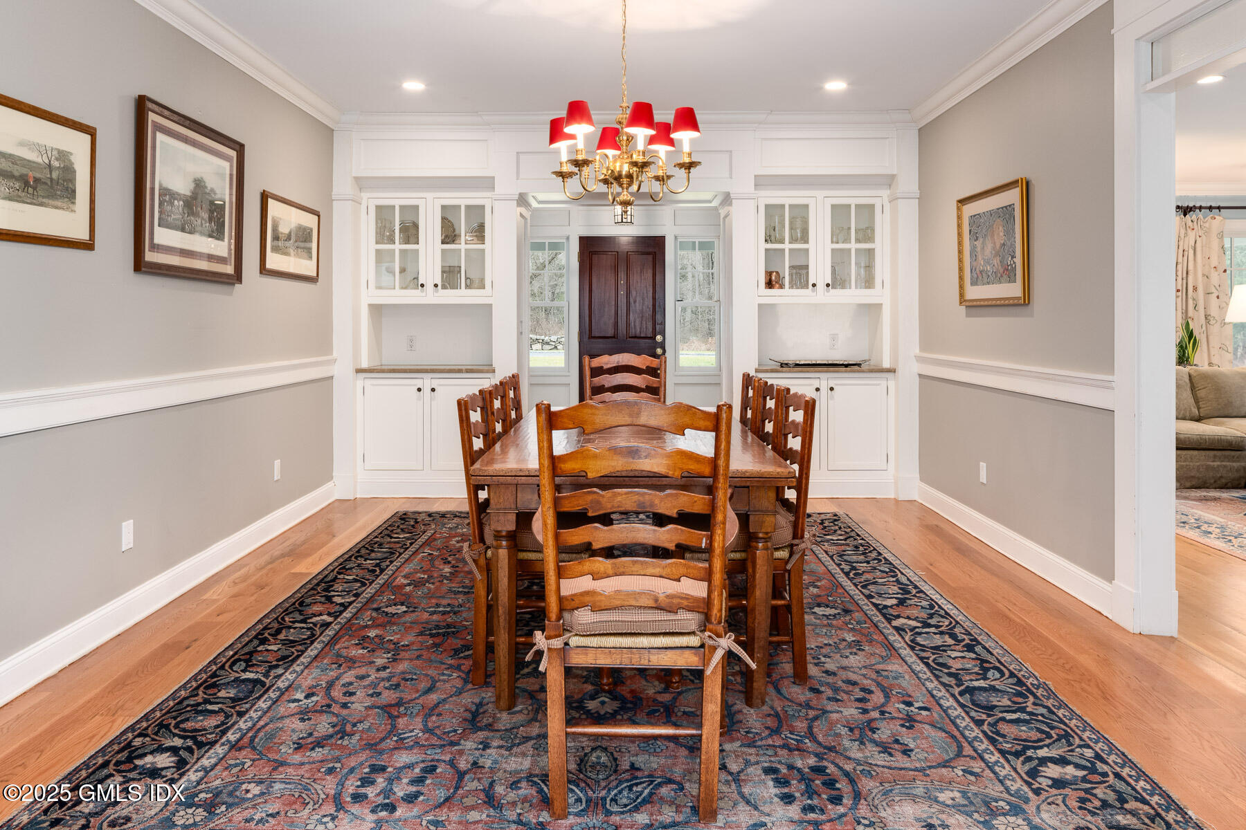 107 Cognewaugh Road Cos Cob, CT 06807 - Photo 12 of 32 a view of a dining room with furniture and chandelier