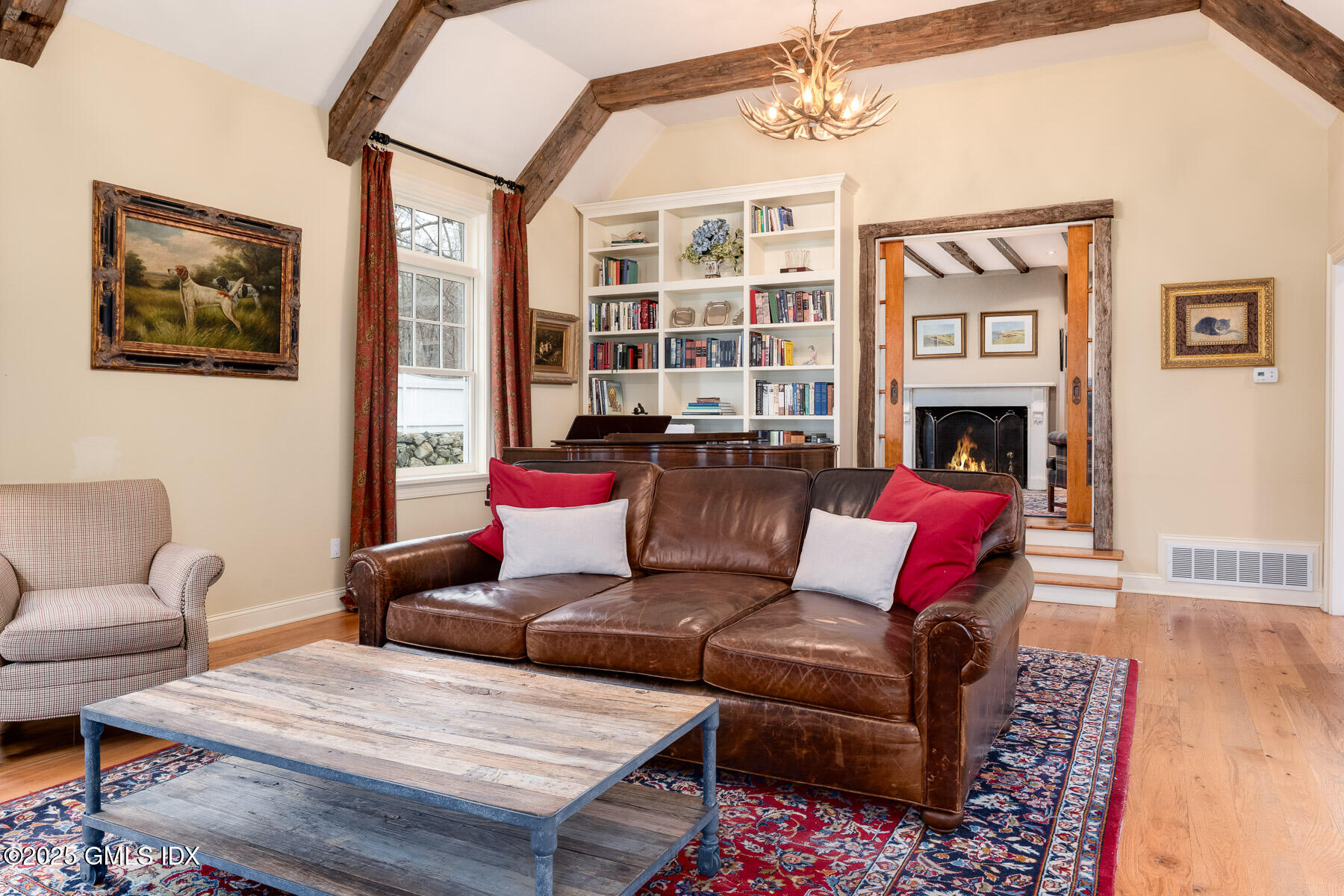 107 Cognewaugh Road Cos Cob, CT 06807 - Photo 10 of 32 a living room with furniture fireplace and wooden floor