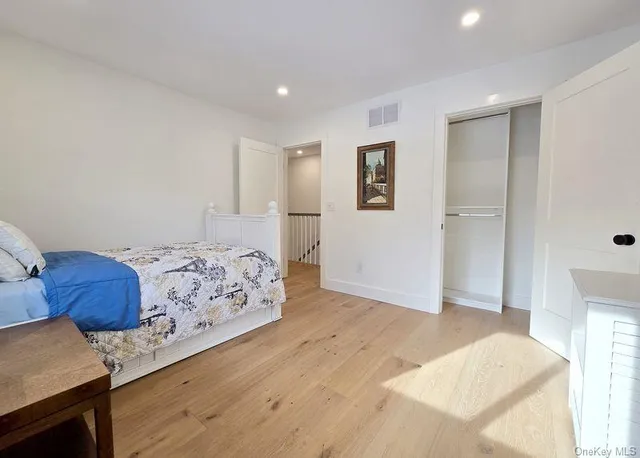 a bedroom with bed and window