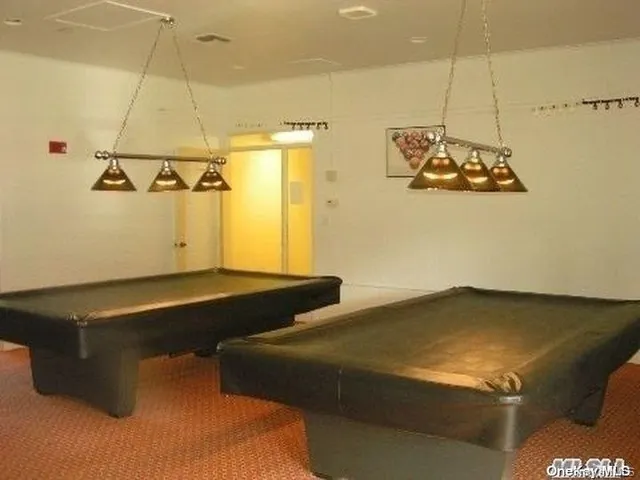 a bedroom with a bed and ceiling fan