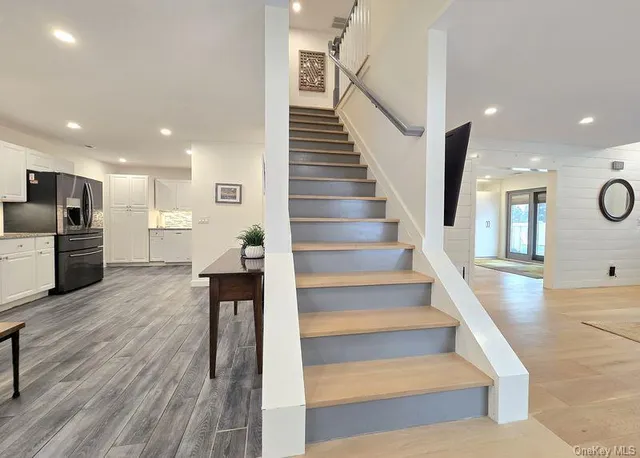 a view of kitchen with cabinets and wooden floor