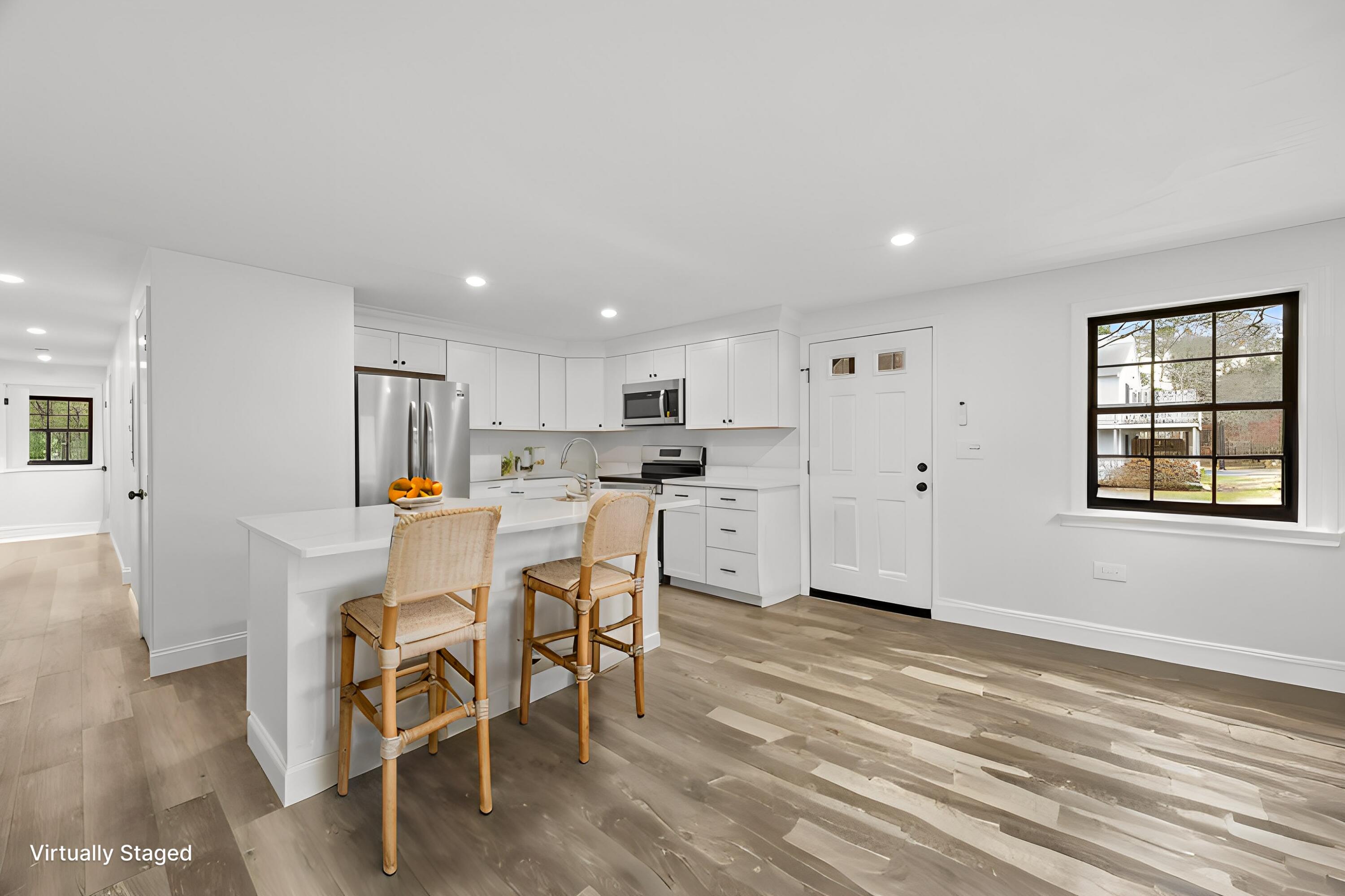 35 Ashumet Road, Unit 9B Mashpee, MA 02649 - Photo 2 of 26 35 Ashumet- Kitchen with stools