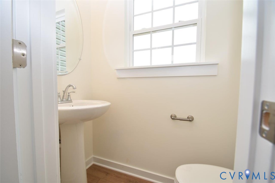 2633 Butterbean Court Henrico, VA 23231 - Photo 18 of 18 a bathroom with a sink a toilet and a mirror