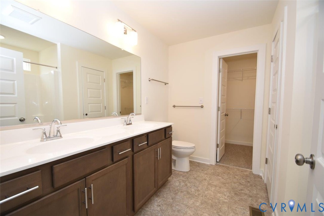 2633 Butterbean Court Henrico, VA 23231 - Photo 8 of 18 a bathroom with a sink a toilet and shower
