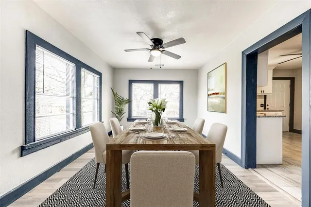 a dining room with furniture and window