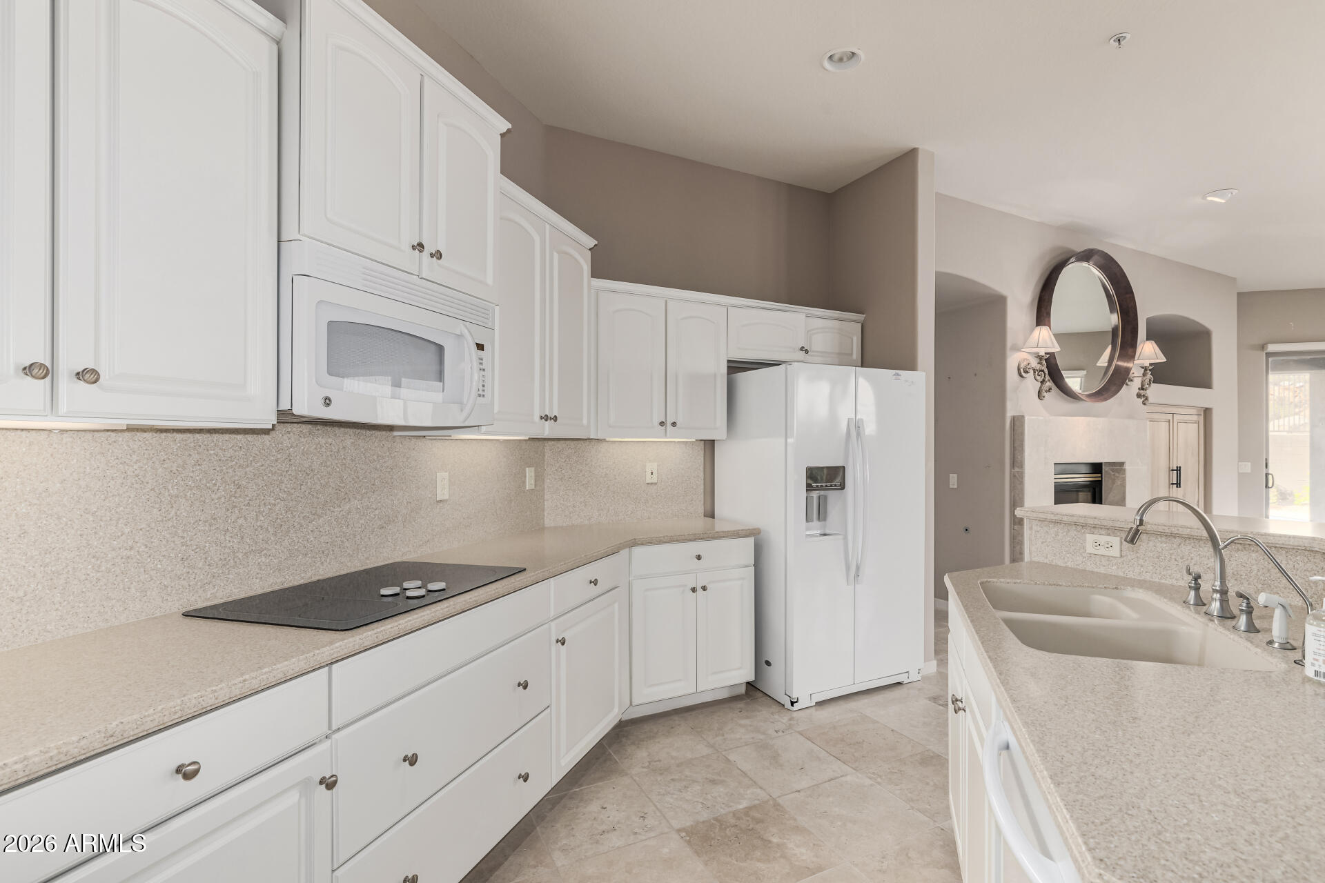 14146 East Coyote Road Scottsdale, AZ 85259 - Photo 11 of 40 a kitchen with granite countertop white cabinets and refrigerator
