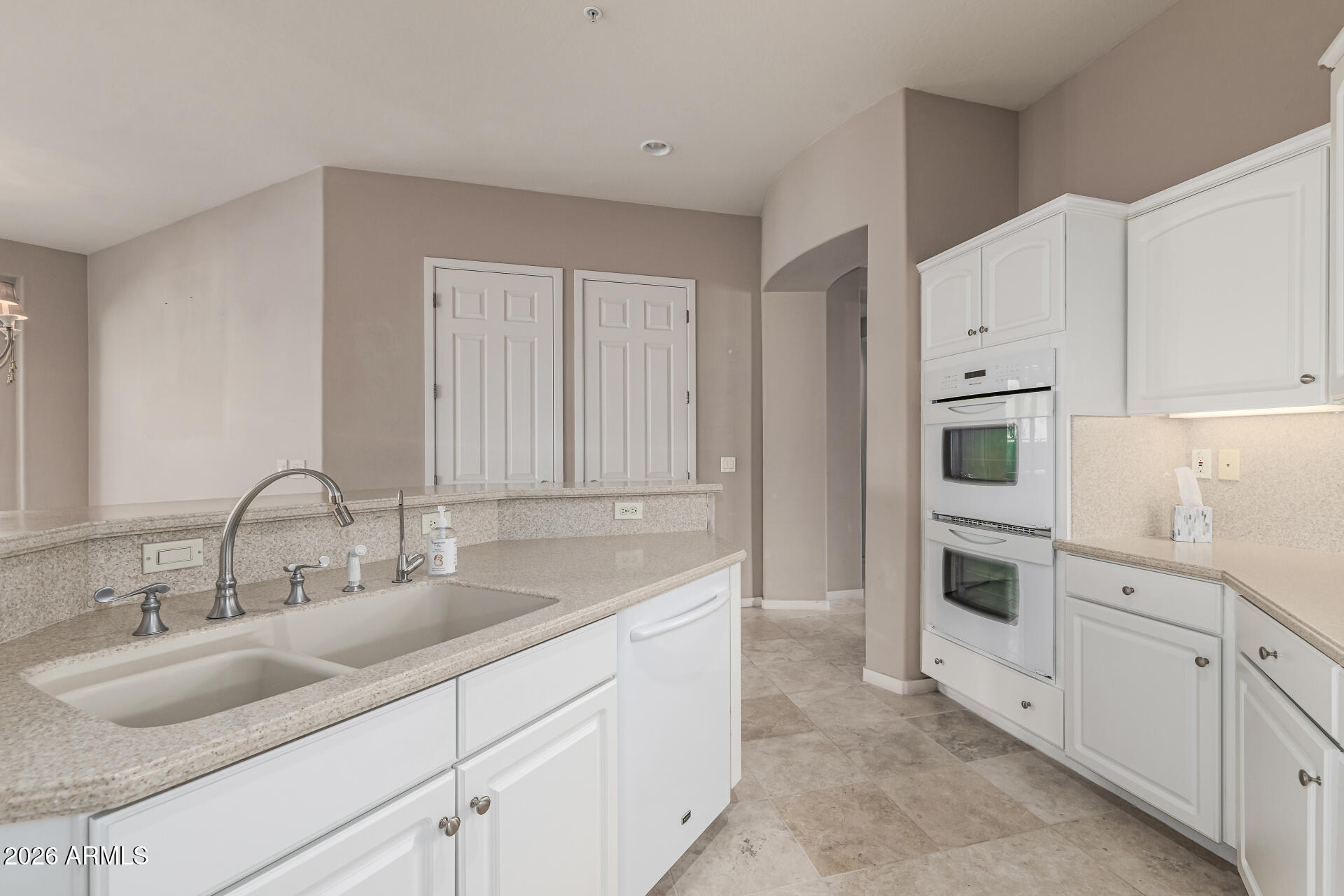 14146 East Coyote Road Scottsdale, AZ 85259 - Photo 12 of 40 a kitchen with cabinets and white stainless steel appliances