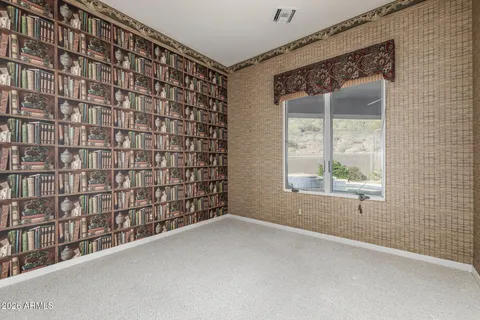 a view of an empty room with a fireplace