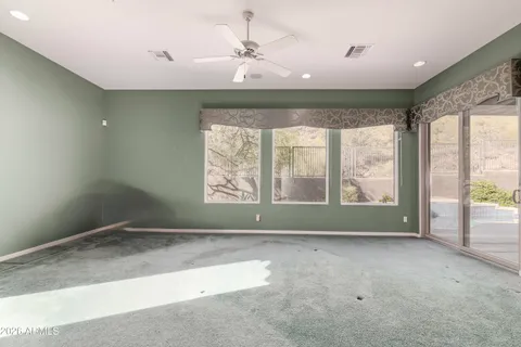 a spacious bathroom with a double vanity sink a mirror and a bathtub