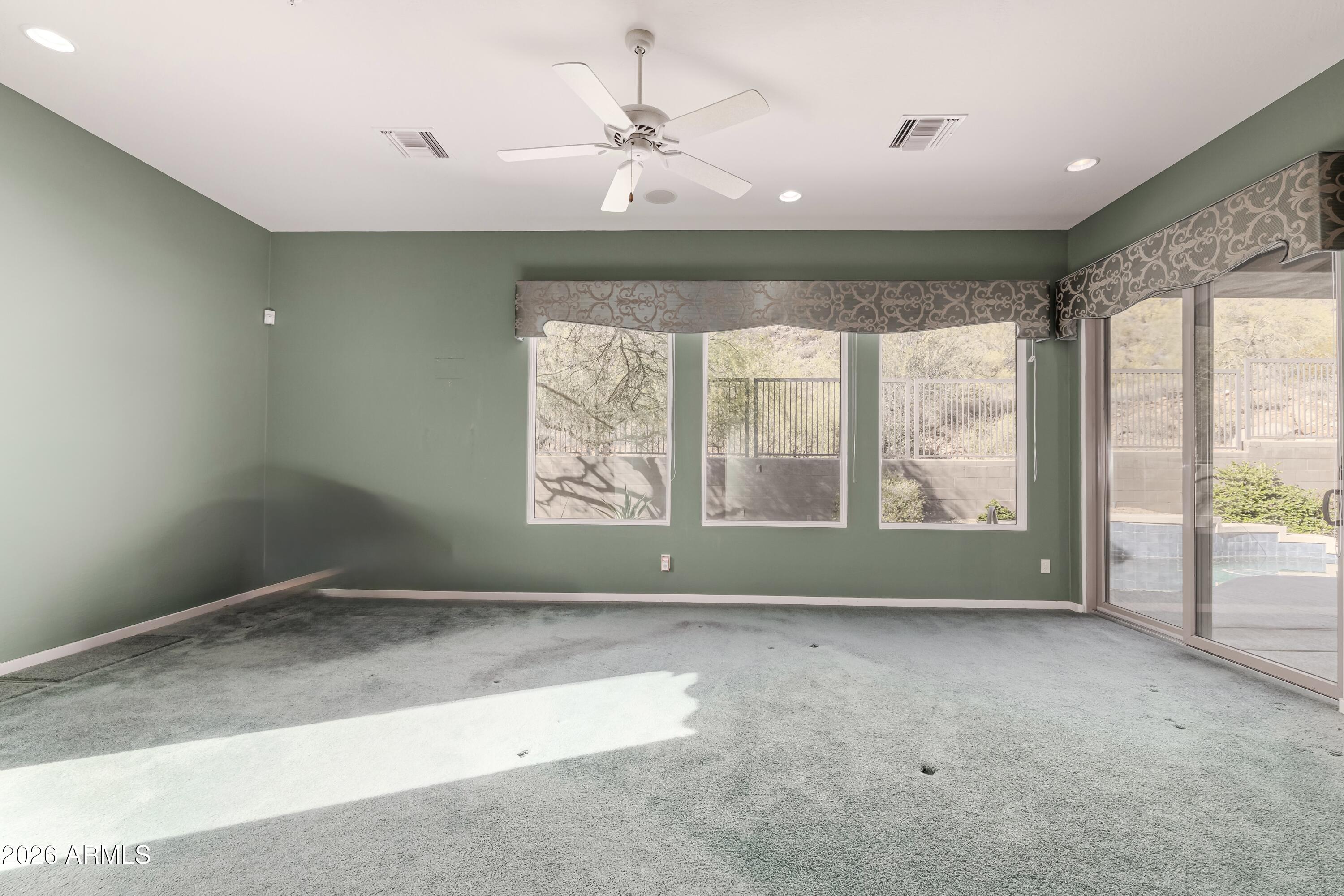 14146 East Coyote Road Scottsdale, AZ 85259 - Photo 16 of 40 a view of room with window and a ceiling fan