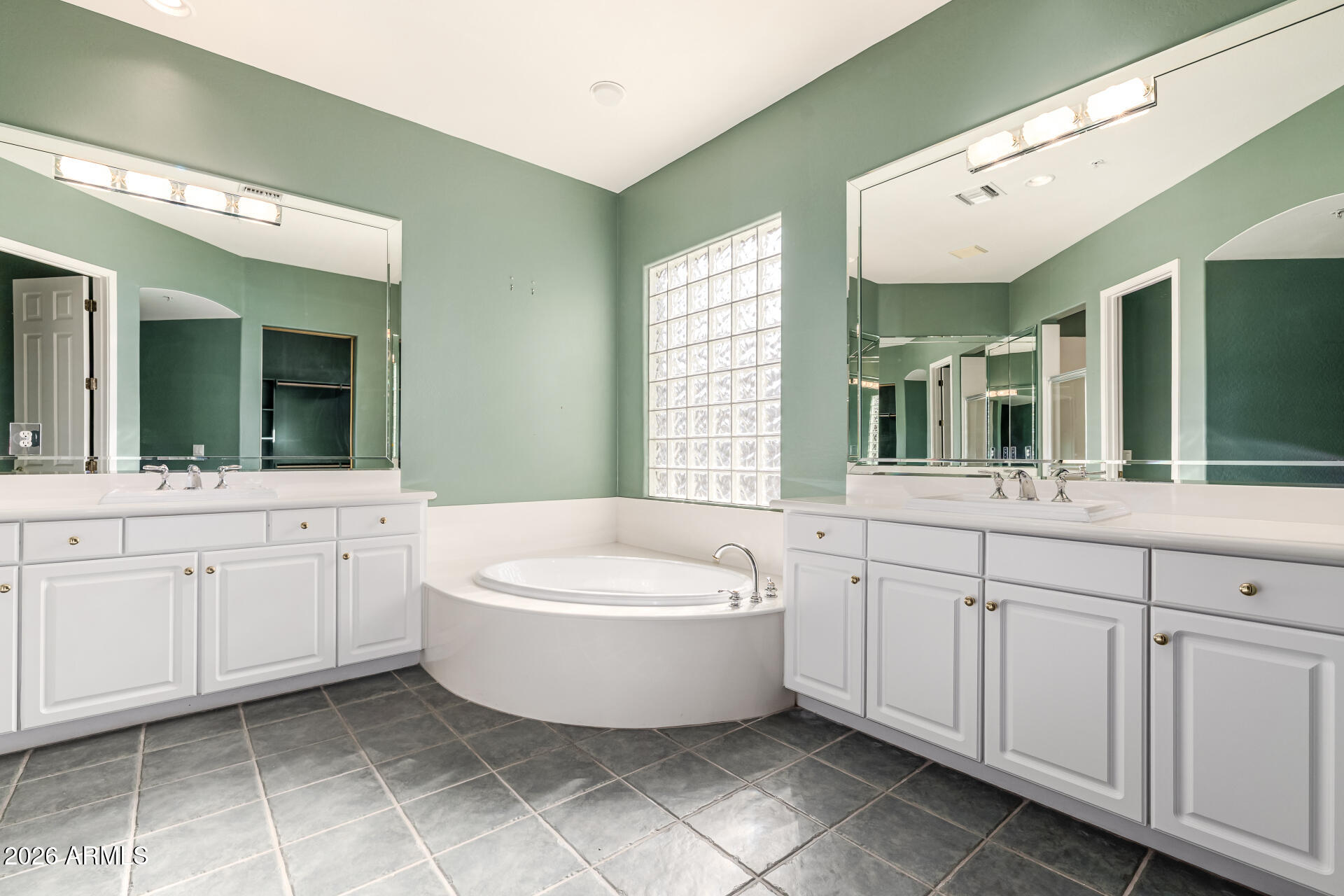 14146 East Coyote Road Scottsdale, AZ 85259 - Photo 17 of 40 a spacious bathroom with a double vanity sink a mirror and a bathtub