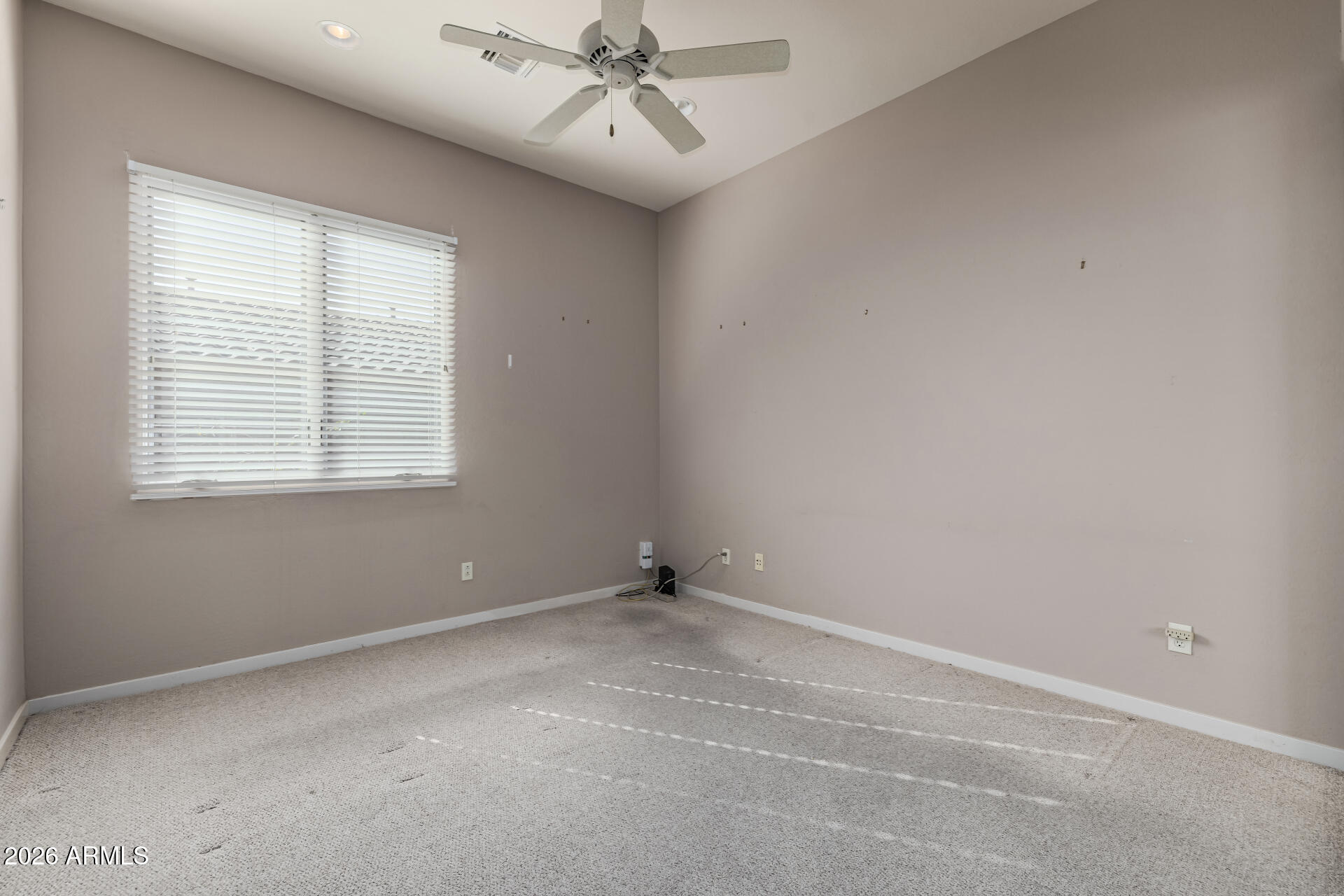14146 East Coyote Road Scottsdale, AZ 85259 - Photo 18 of 40 an empty room with windows and fan