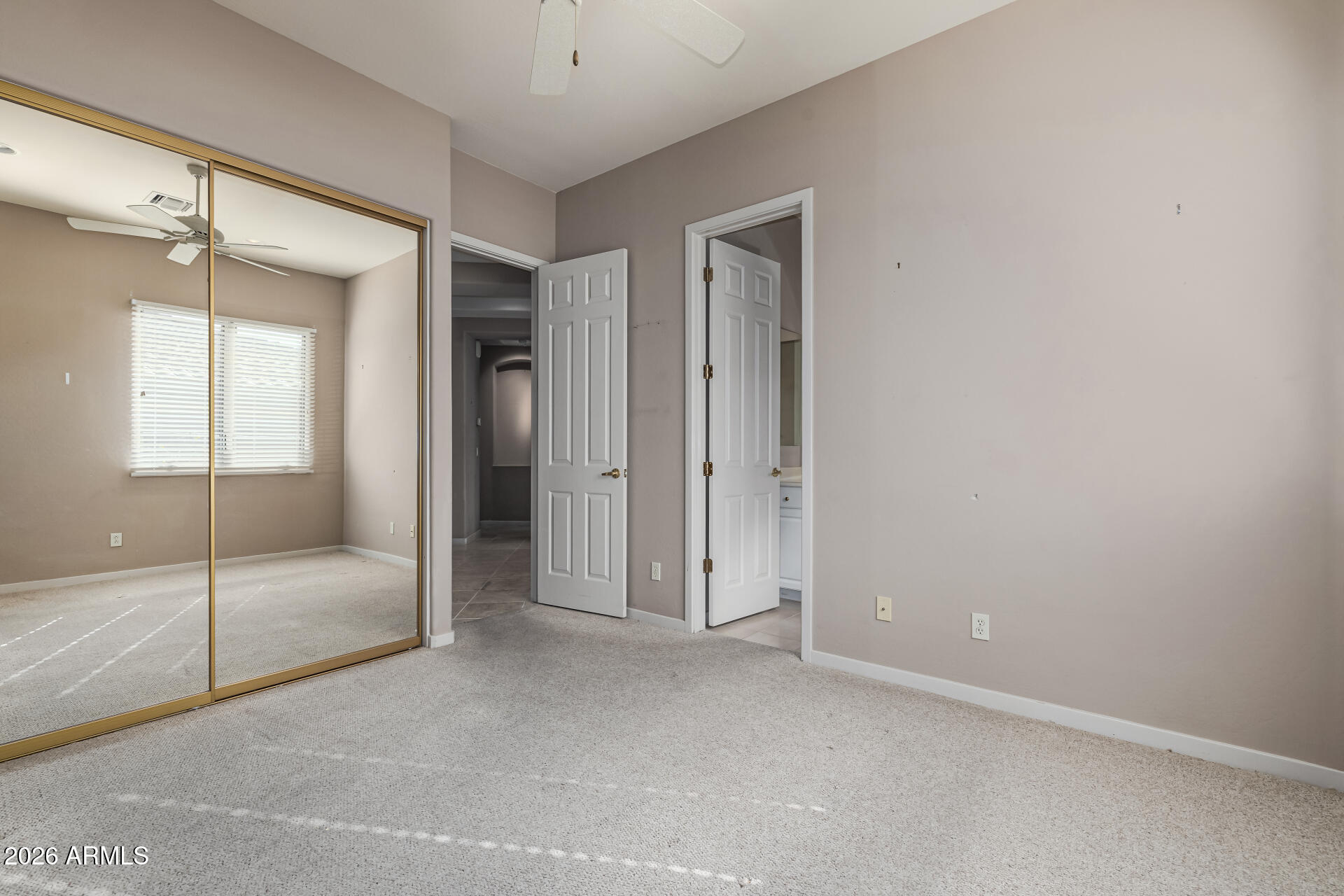 14146 East Coyote Road Scottsdale, AZ 85259 - Photo 19 of 40 an empty room with cabinet and glass door