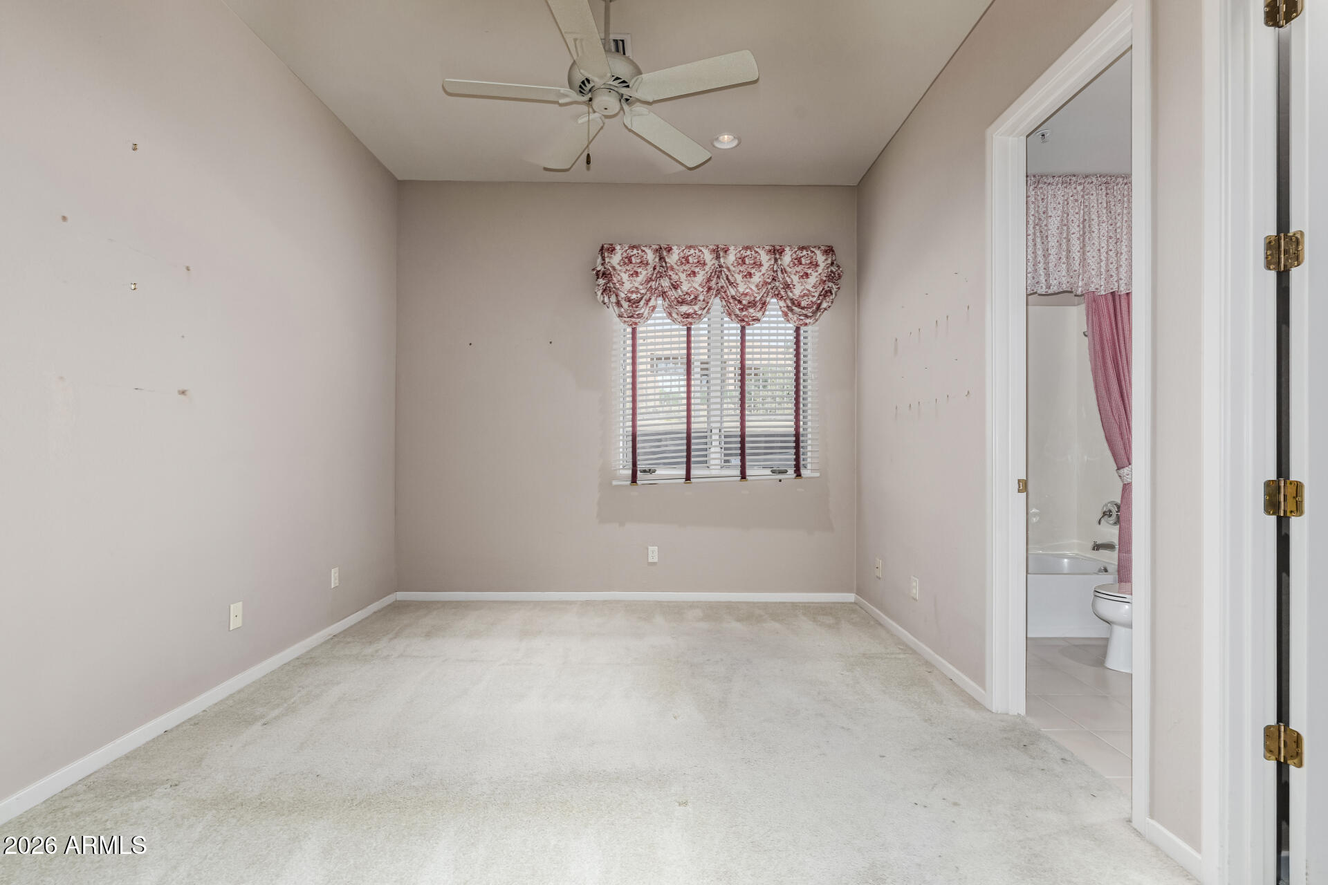 14146 East Coyote Road Scottsdale, AZ 85259 - Photo 21 of 40 an empty room with windows and chandelier fan