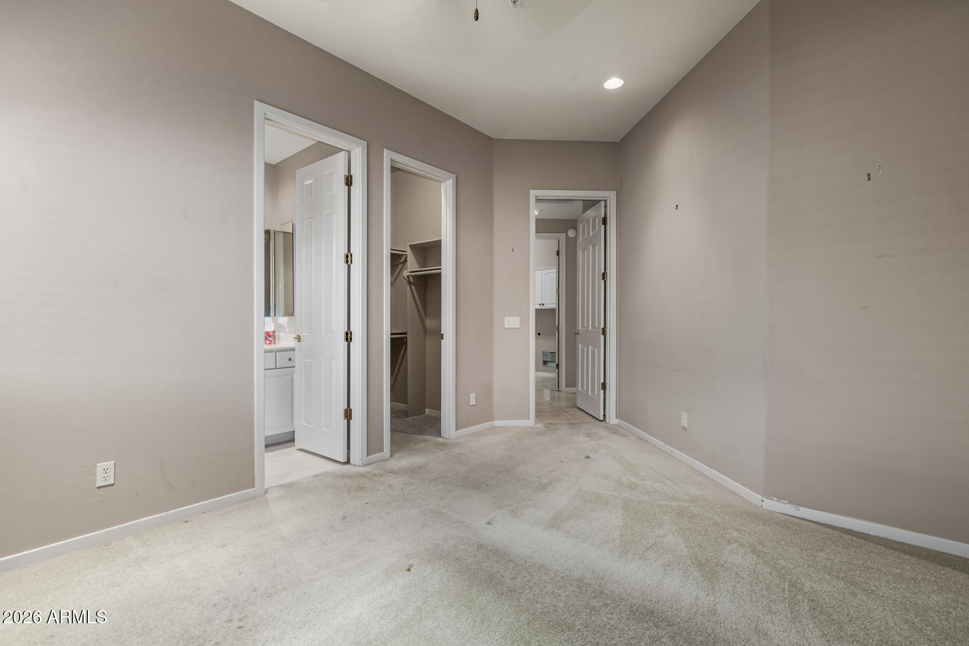 14146 East Coyote Road Scottsdale, AZ 85259 - Photo 22 of 40 an empty room with closet and wooden door