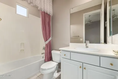 a view of an entryway with a floor to ceiling window and chandelier