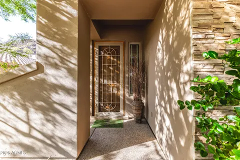 a view of a back yard from a corridor