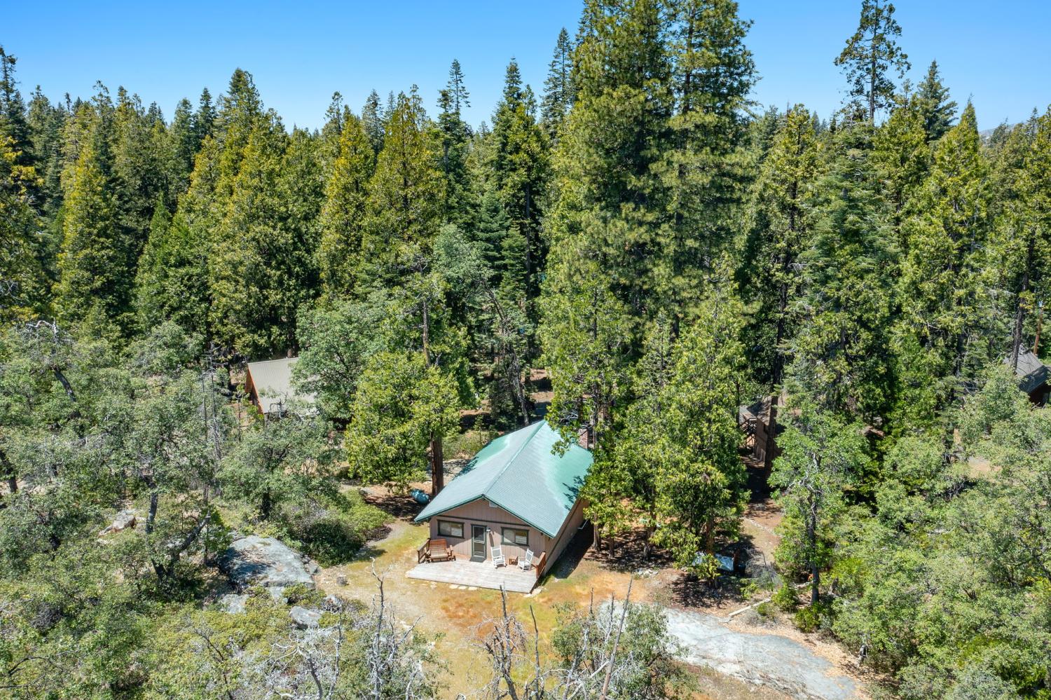 42488 Rock Ledge Road Shaver Lake, CA 93664 - Photo 25 of 26 an aerial view of a house with a yard