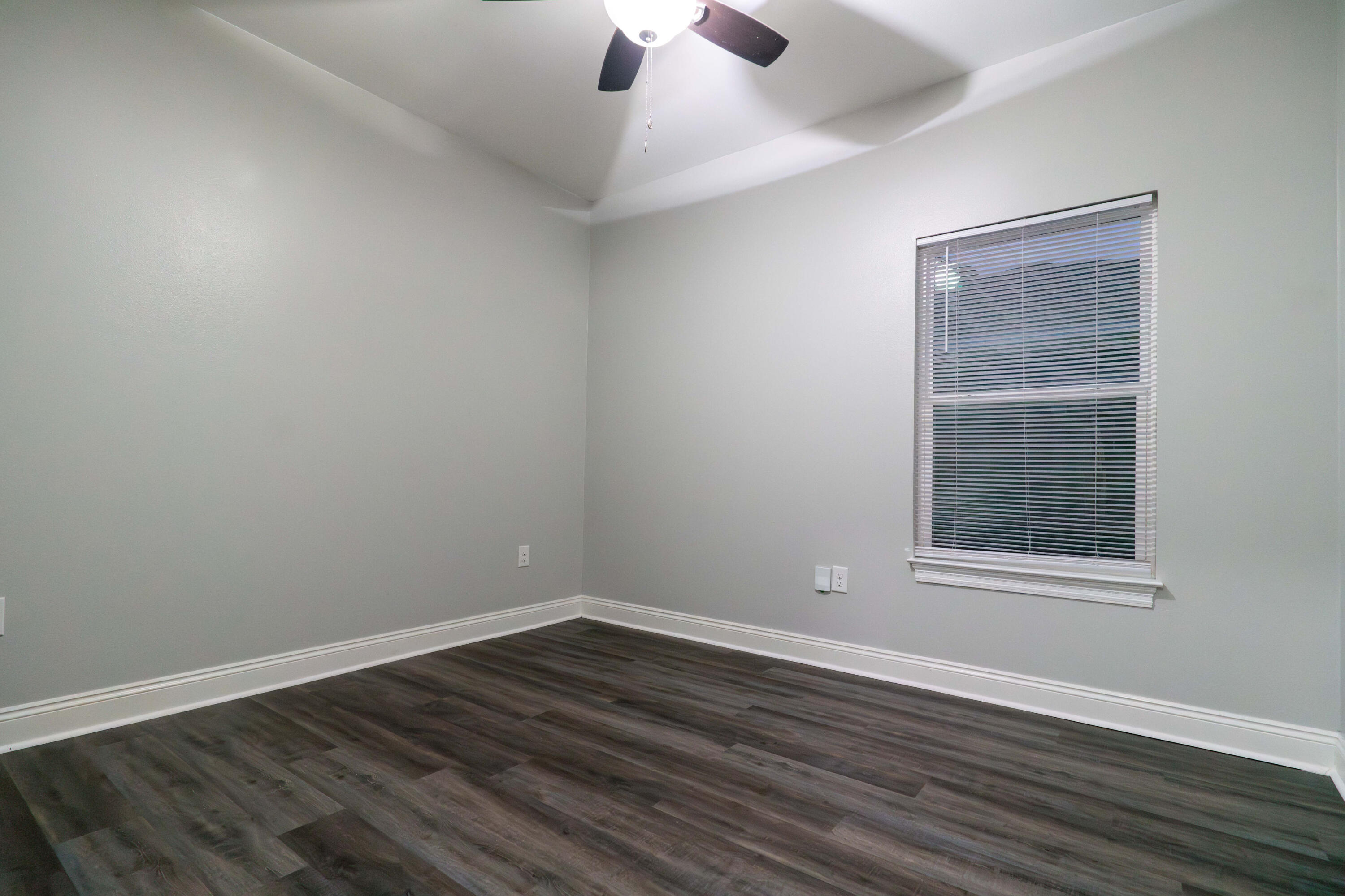 2243 Wind Trace Road North Navarre, FL 32566 - Photo 26 of 34 wooden floor in an empty room with a window