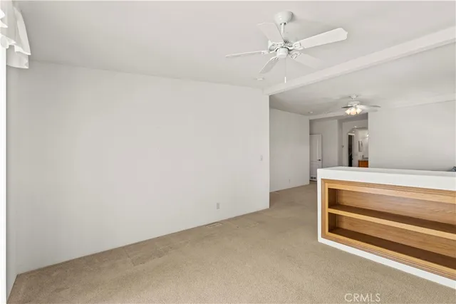 a view of room with a ceiling fan