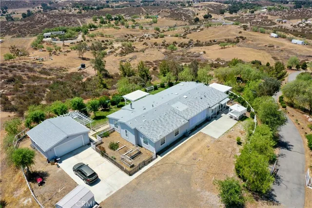 an aerial view of residential house with outdoor space