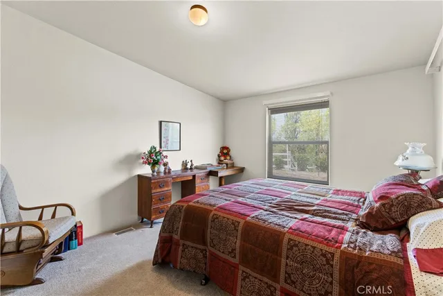 a bedroom with a bed and window