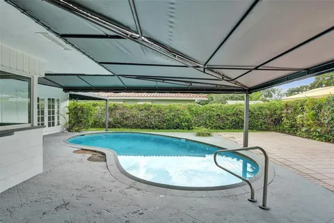 a swimming pool with outdoor space