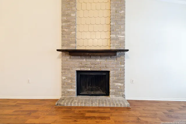 a living room with a fireplace and a floor