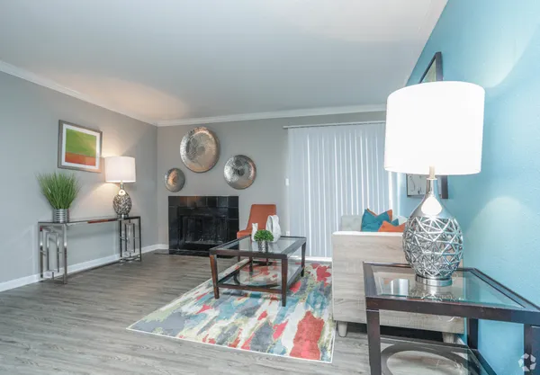 a living room with furniture a table and chair