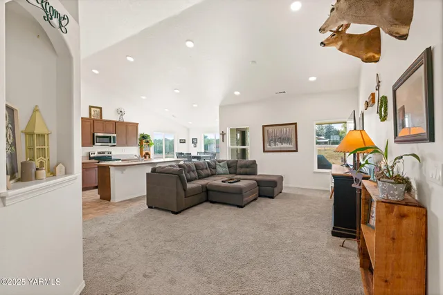 a living room with furniture and flat screen tv