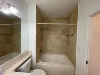 a bathroom with a shower and bathtub